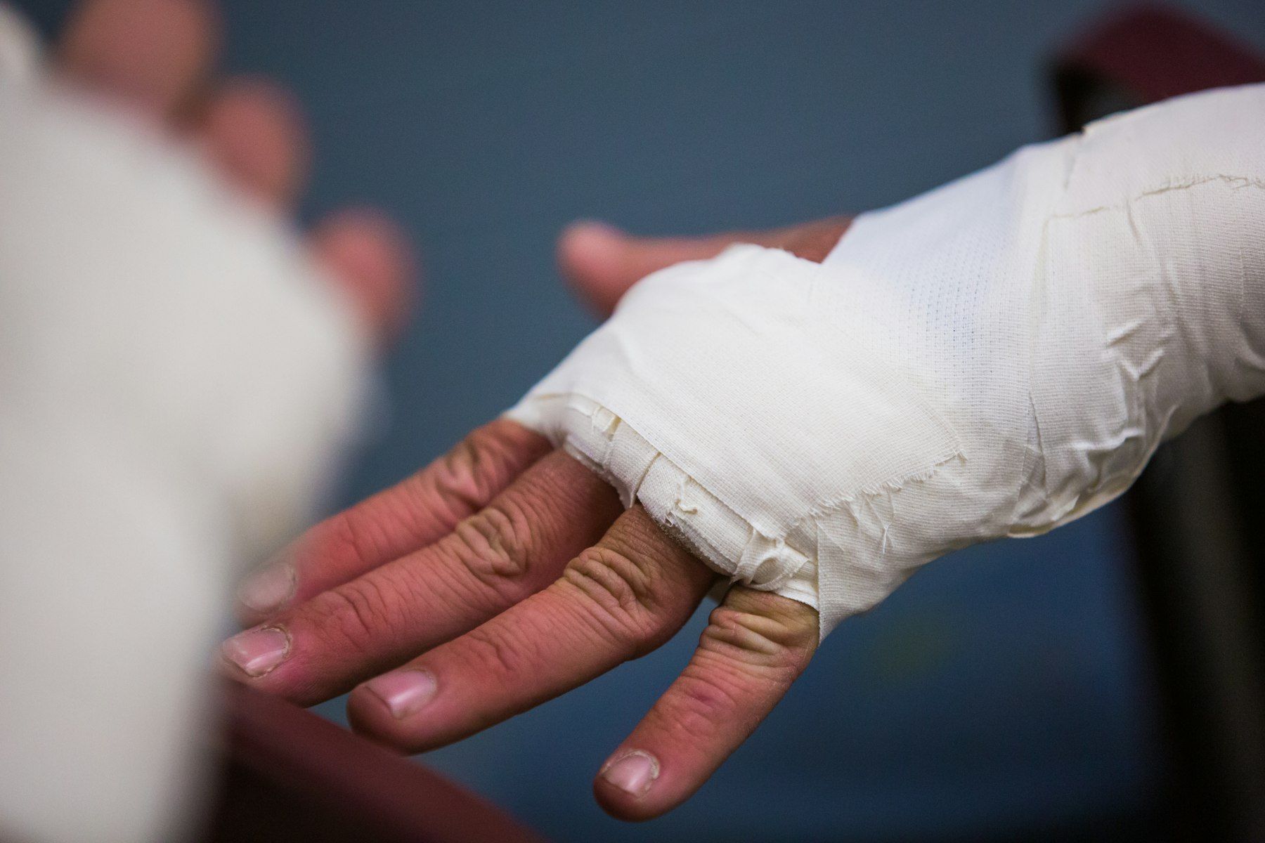A hand with a fresh white dressing