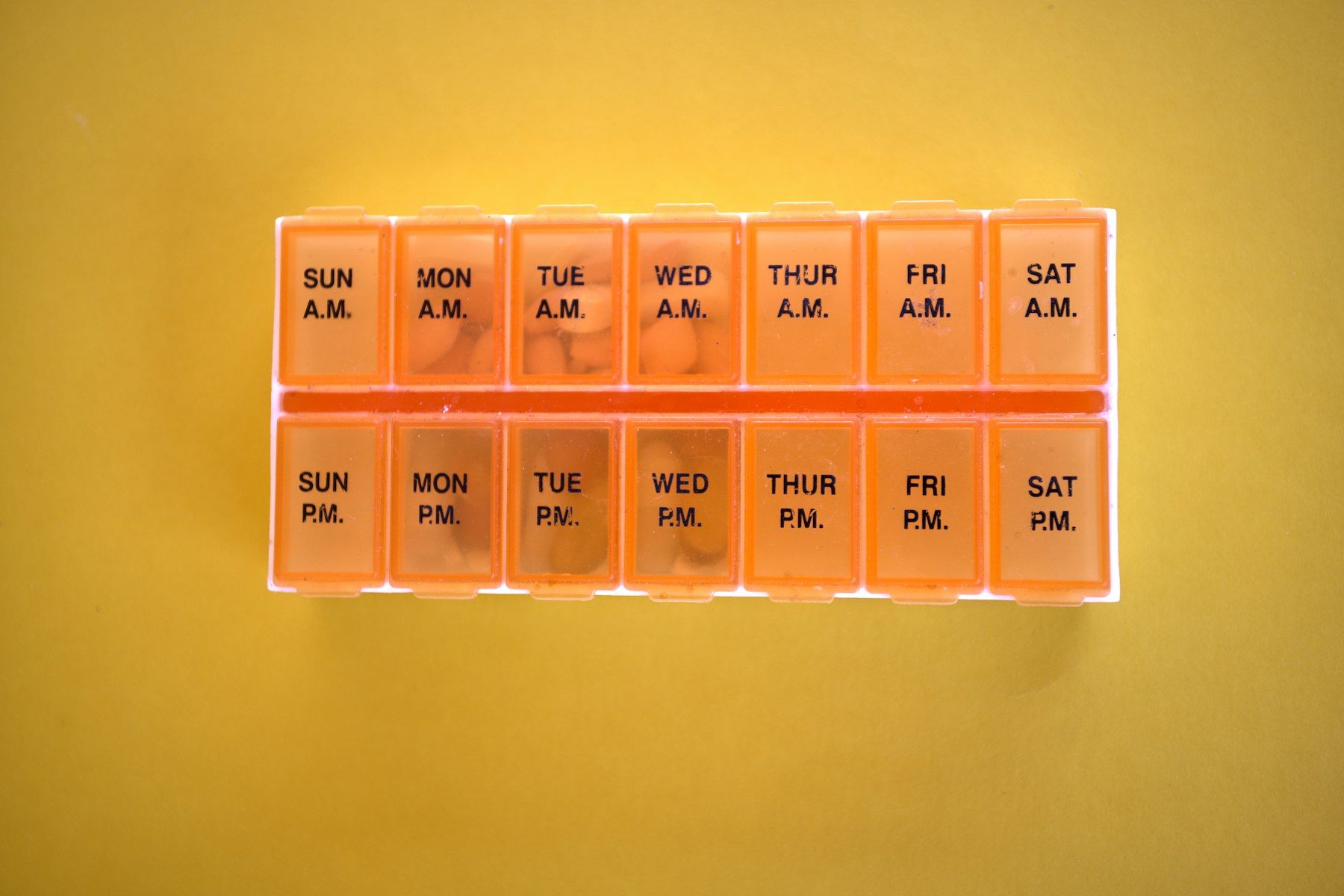 A weekly pill organiser with morning and evening compartments